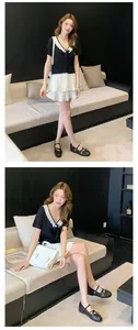 Model wearing black French Mary Jane ballet flats with a white bow detail