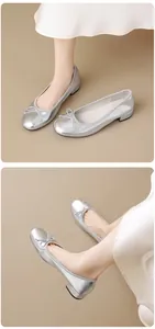 Elegant silver round-toe ballet flats with bow detail and low block heel shoe details