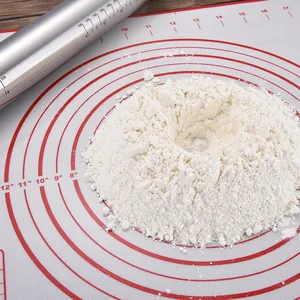 Large non-stick silicone baking mat with circular measurement markings and flour