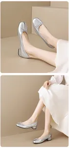 Close-up view of silver ballet flats with bow decoration shown on feet from multiple angles