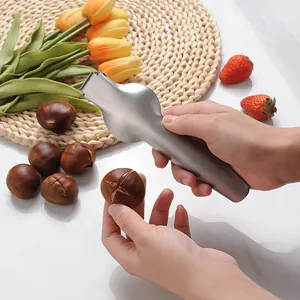Ergonomic stainless steel chestnut opener and nut cracker tool for home kitchen use.