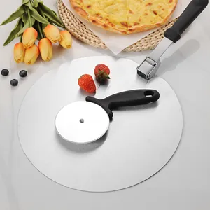 Professional stainless steel folding pizza peel and circular cutter wheel set on marble