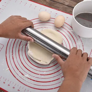 Large non-stick silicone pastry mat with red measurements and stainless steel rolling pin