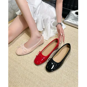 Elegant French-style ballet flats with bow detail and hidden wedge, available in three colors