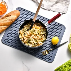 Large grey silicone heat resistant drying mat with wavy texture for kitchen counter