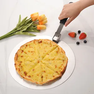 Stainless steel round foldable pizza peel shovel with pizza on white marble surface