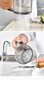 Close-up detail of a handheld semi-automatic flour sifter showing fine mesh texture