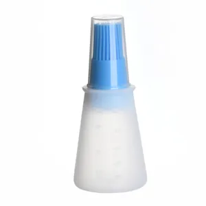 Transparent silicone oil bottle with blue brush and measurement scales for healthy cooking