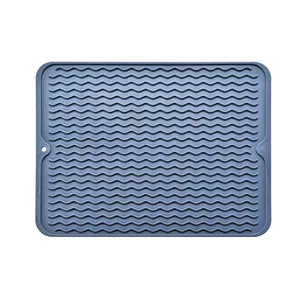 Large grey-blue silicone drying mat with non-slip wavy texture for kitchen counter.