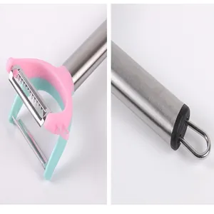 Detail shot of the dual-head stainless steel vegetable peeler with hanging loop handle
