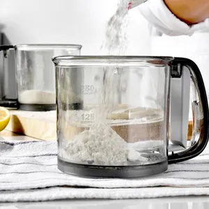 Professional manual flour sifter with measurement markings for home baking and cooking