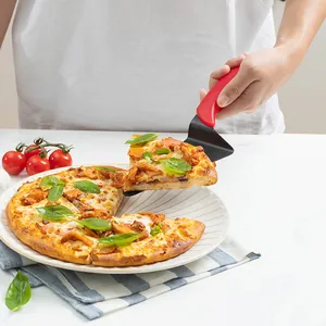 Pizza server with non-stick black blade and ergonomic red plastic handle for baking