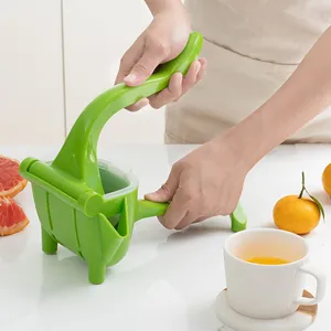 Presse-agrumes manuel en plastique vert pour l'extraction de citron et d'orange