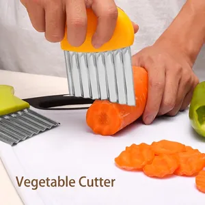 Stainless steel wave vegetable cutter tool for crinkle cut potato chips and carrots.