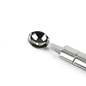 Stainless steel dual-purpose fruit baller and carving knife for creative fruit platters.