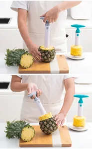 Detail view showing the plastic pineapple corer tool removing fruit core in a kitchen