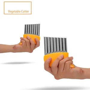 Stainless steel vegetable crinkle cutter for wavy potato slices and chips.