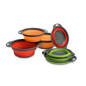 Set of three multi-colored foldable silicone colanders with drainage holes for kitchen