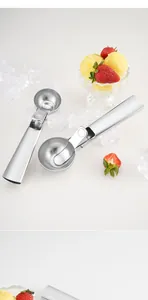 Detail showing a stainless steel ice cream scoop with a polished finish and release lever.