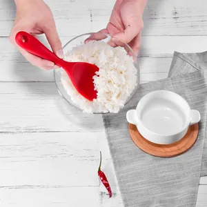 Premium non-stick red silicone rice spoon scoop being used to serve rice in kitchen