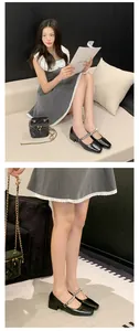 Detail view of French style black Mary Jane heels with rhinestone straps on a model