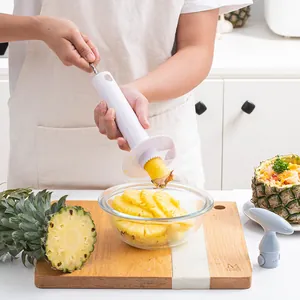 Manual pineapple corer and slicer tool for quick fruit preparation in kitchen