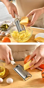 Close-up detail of a professional stainless steel grater shredding cheese on a wood board
