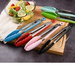 Detailed close-up of multi-colored heat-resistant silicone kitchen tongs on a board