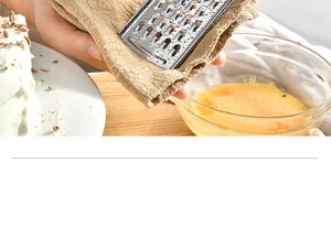 Detailed macro view of a durable stainless steel cheese grater for precise kitchen grating