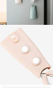 Detailed view of magnetic scissor holder with strong magnets for fridge mounting