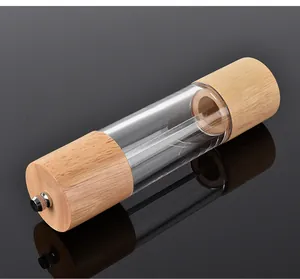 Detail of manual pepper grinder made with natural oak wood and clear acrylic view
