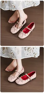 Elegant light pink Mary Jane ballet flats with gold studs and bow detail for women