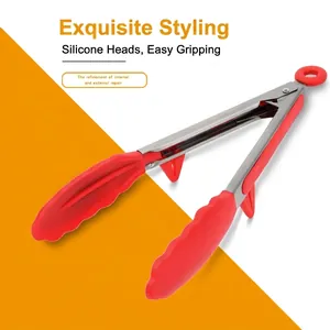 Red silicone kitchen tongs with stainless steel handle and built-in stand