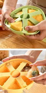 Detail view showing food being easily released from a flexible silicone mold for baby snacks.