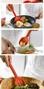 Λεπτομερής προβολή του σετ κόκκινης σπάτουλας και κουταλιού σιλικόνης στην κουζίνα