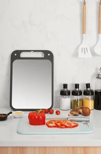 Double-sided 304 stainless steel and wheat straw cutting board in a modern kitchen.