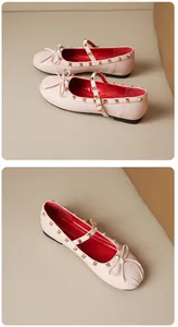 Detail view of pink Mary Jane flats featuring gold rivets, bow accent and red lining