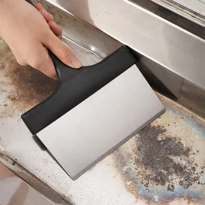 Professional stainless steel BBQ grill scraper tool removing residue from metals