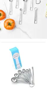 Detailed view of 7-piece stainless steel measuring spoon set with scales and box
