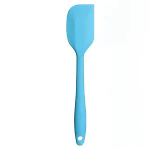 Small light blue one-piece silicone spatula for baking cream and butter frosting