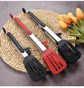 Detailed view of heat-resistant silicone spatula tongs with built-in stands for kitchen use