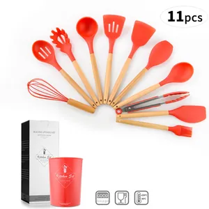 11-piece red silicone kitchen utensil set with wooden handles and storage bucket