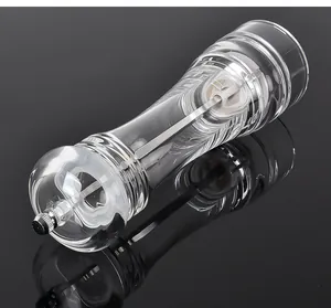 Premium clear acrylic spice grinder with ceramic core on a black reflective surface