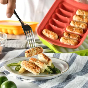 Silicone sausage mold for baby food prep featuring fresh cooked homemade sausages