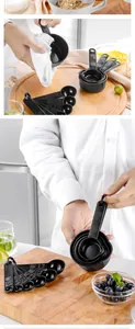 Detail of 11-piece black measuring set with embossed cup and spoon measurements