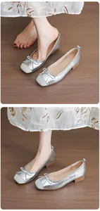 Elegant silver ballet flats featuring a chic bow detail and comfortable low block heel