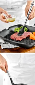 Détail d'un pinceau en silicone avec manche inox huilant un steak dans une poêle à griller