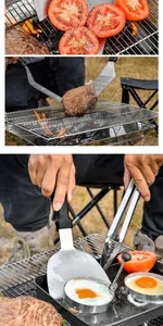 Λεπτομέρεια από σπάτουλα και τσιμπίδα BBQ inox που ψήνουν μπριζόλα και αυγά σε φωτιά