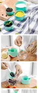 Close-up of 8-piece teal measuring cups and spoons set in kitchen use