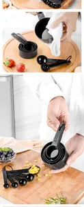 Close-up of black plastic 10-piece measuring cups and spoons set for baking